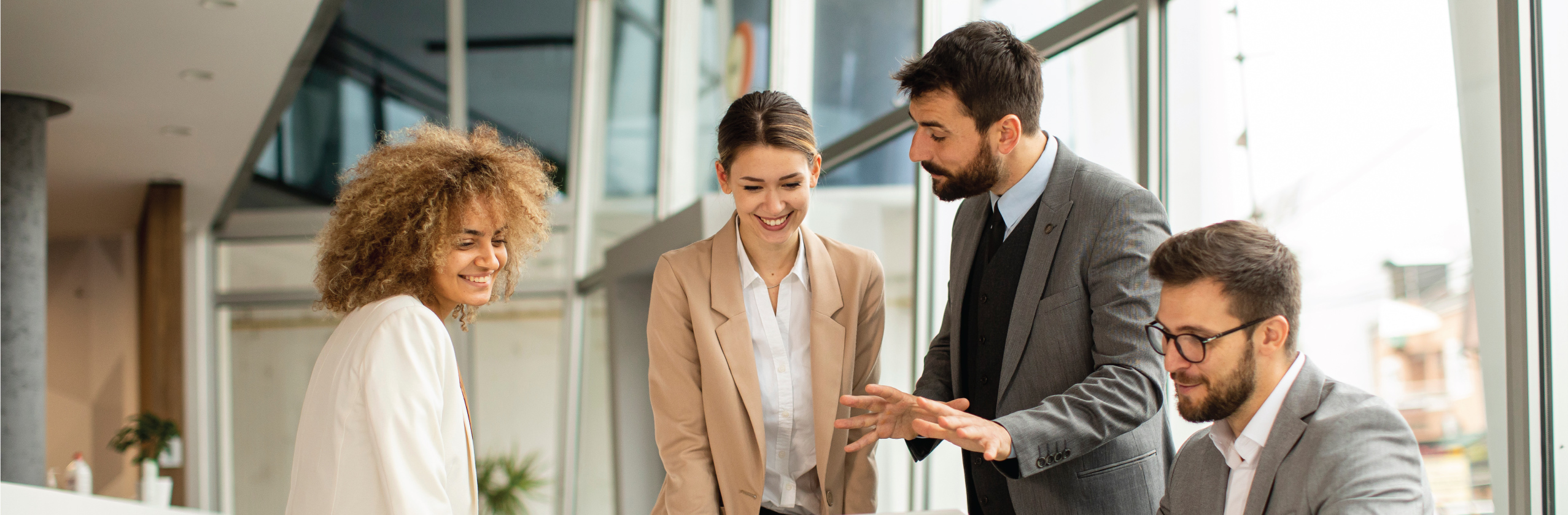 Employees meeting and talking in an office